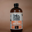 Load image into Gallery viewer, Bottle of Crude Carnivore Pork Bone Broth on a brown background