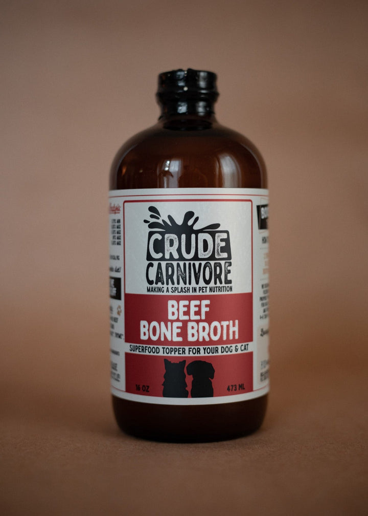 Bottle of Crude Carnivore Beef Bone Broth on a brown background