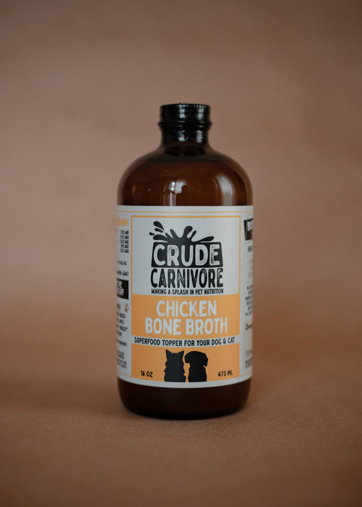Bottle of Crude Carnivore Chicken Bone Broth on a brown background