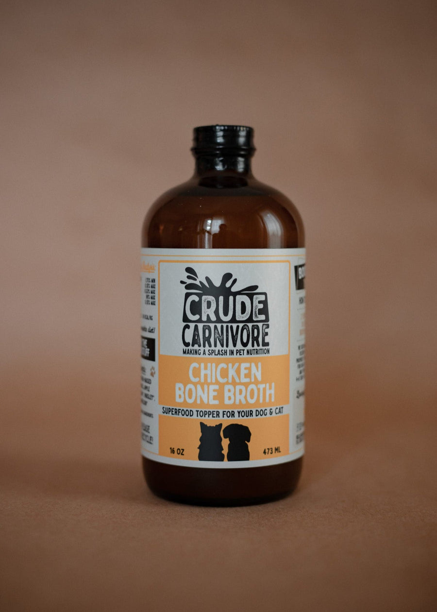 Bottle of Crude Carnivore Chicken Bone Broth on a brown background