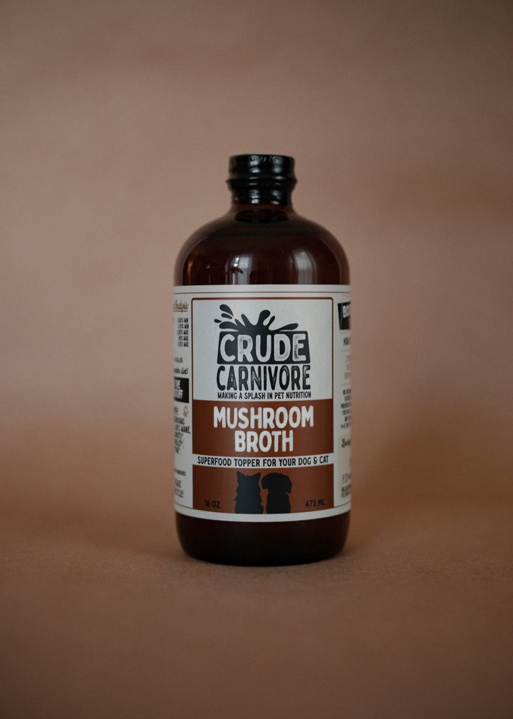 Bottle of Crude Carnivore Mushroom Broth on a brown background