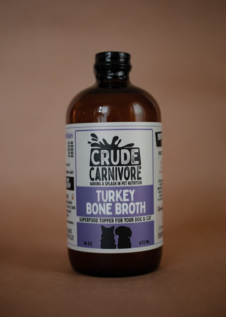 Bottle of Crude Carnivore Turkey Bone Broth on a brown background